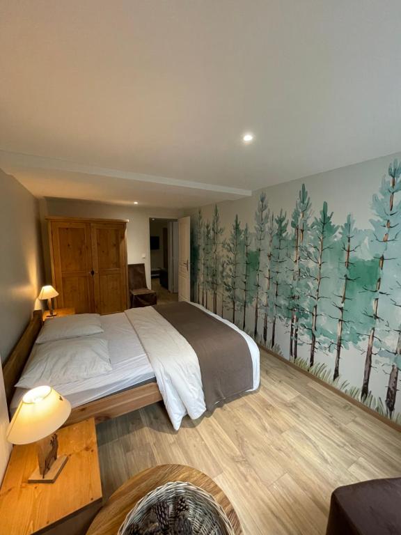 Posteľ alebo postele v izbe v ubytovaní LE LOFT et le T2, Le Mont Dore, au pied de La Dordogne