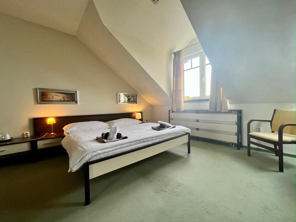 A bed or beds in a room at Penzion Félix