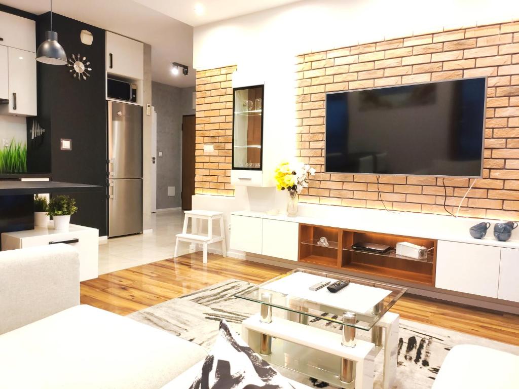 Televízia a/alebo spoločenská miestnosť v ubytovaní Szafrana 5B by Homeprime