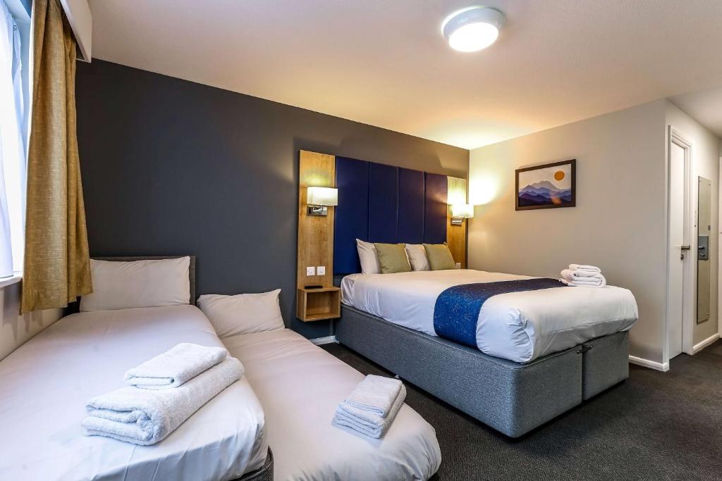 Postel nebo postele na pokoji v ubytování Days Inn London Stansted Airport