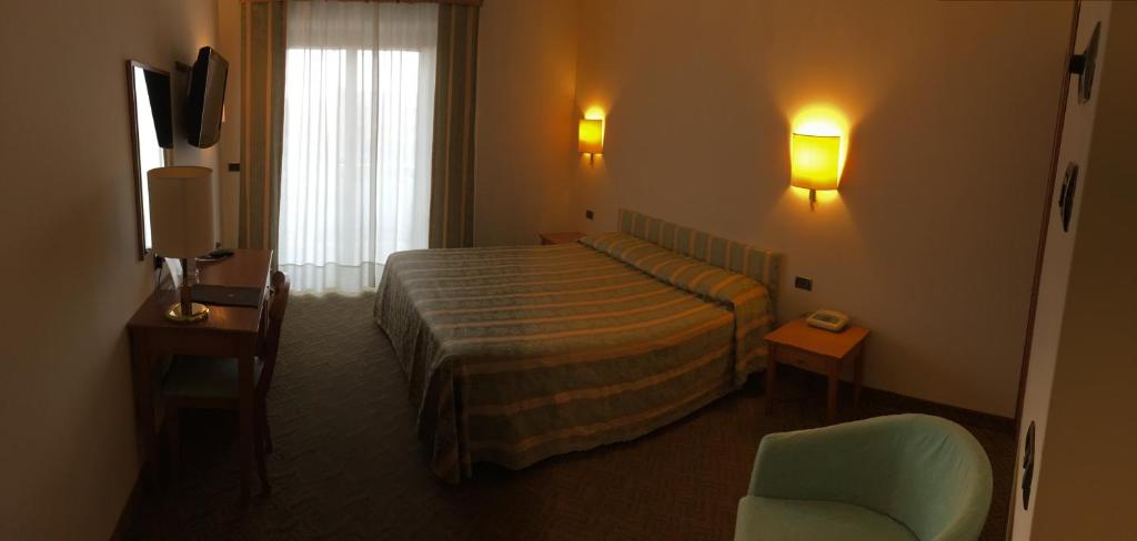 Postel nebo postele na pokoji v ubytování Savant Hotel