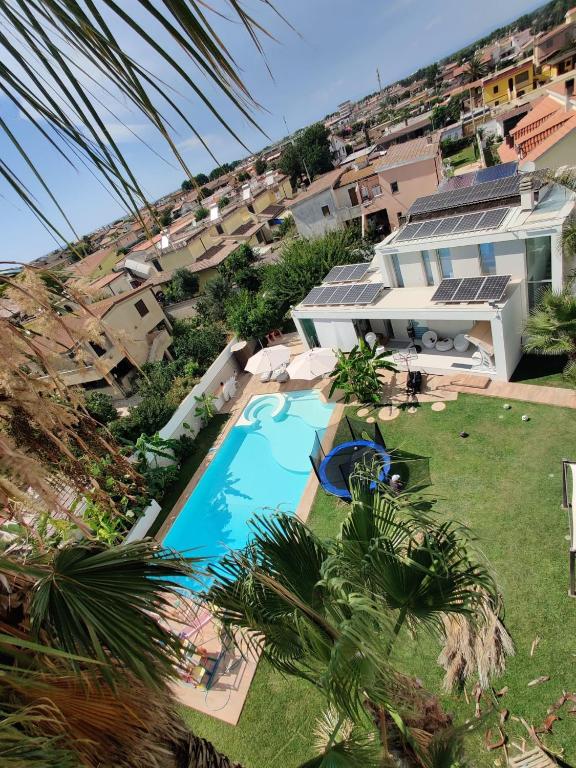 an overhead view of a swimming pool in front of a house at Eden Luxury Villa in Focene