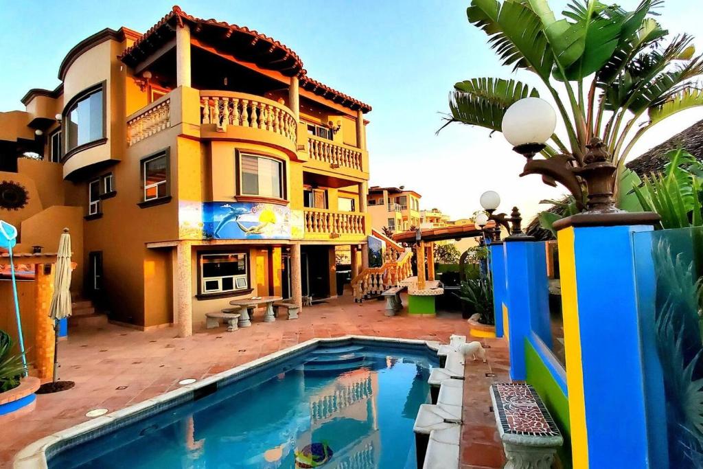 a house with a swimming pool in front of it at 5 bedroom Beachfront pool & Spa in Ensenada
