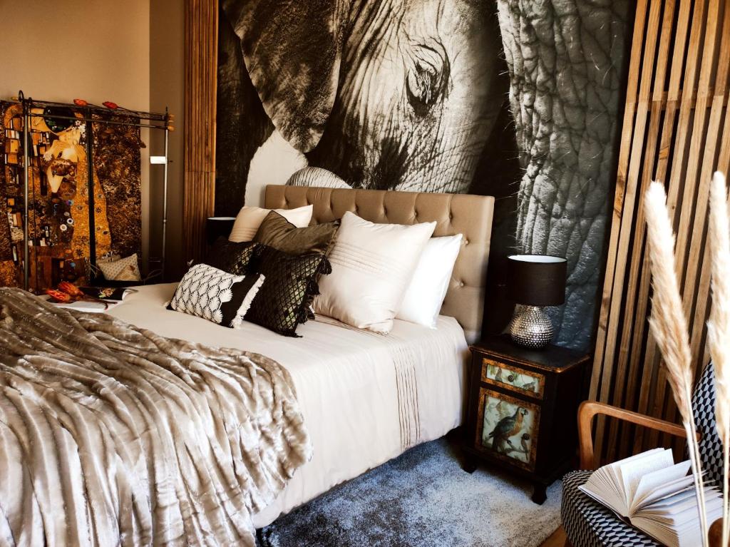 Ένα ή περισσότερα κρεβάτια σε δωμάτιο στο Appartements design - Uniques - Centre