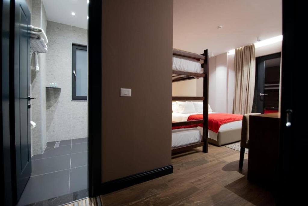 Postel nebo postele na pokoji v ubytování Mergan Hotel