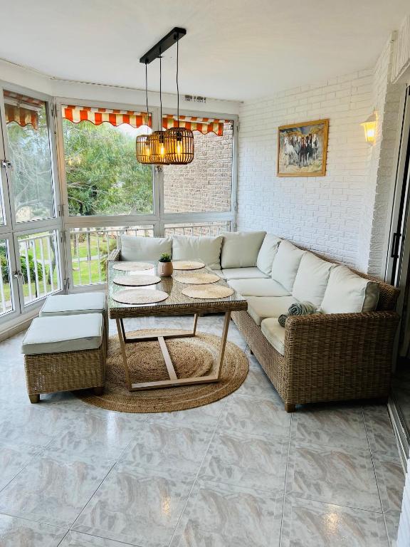 a living room with a couch and a table at Sinforosa Park Apartments in Torrevieja