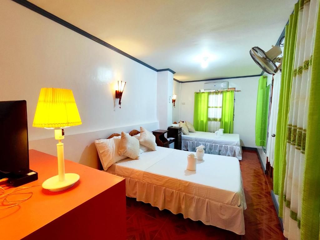 Postel nebo postele na pokoji v ubytování Evan's Homestay