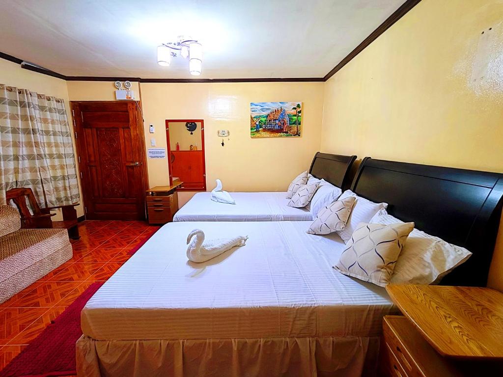 Postel nebo postele na pokoji v ubytování Evan's Homestay