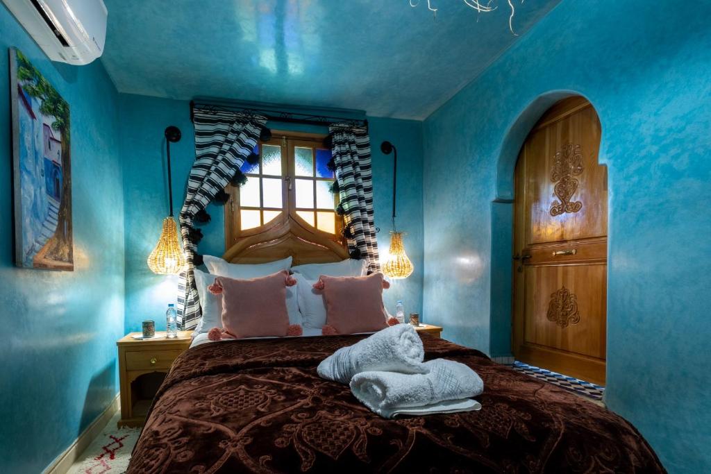 Cama ou camas em um quarto em Riad Mosaic