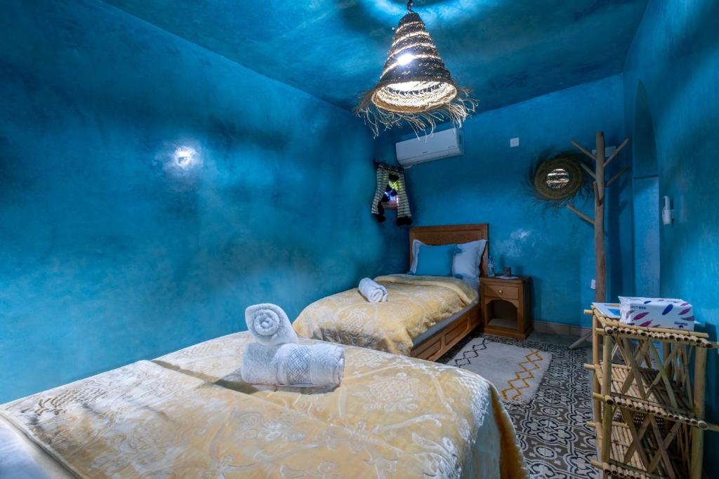 Cama ou camas em um quarto em Riad Mosaic