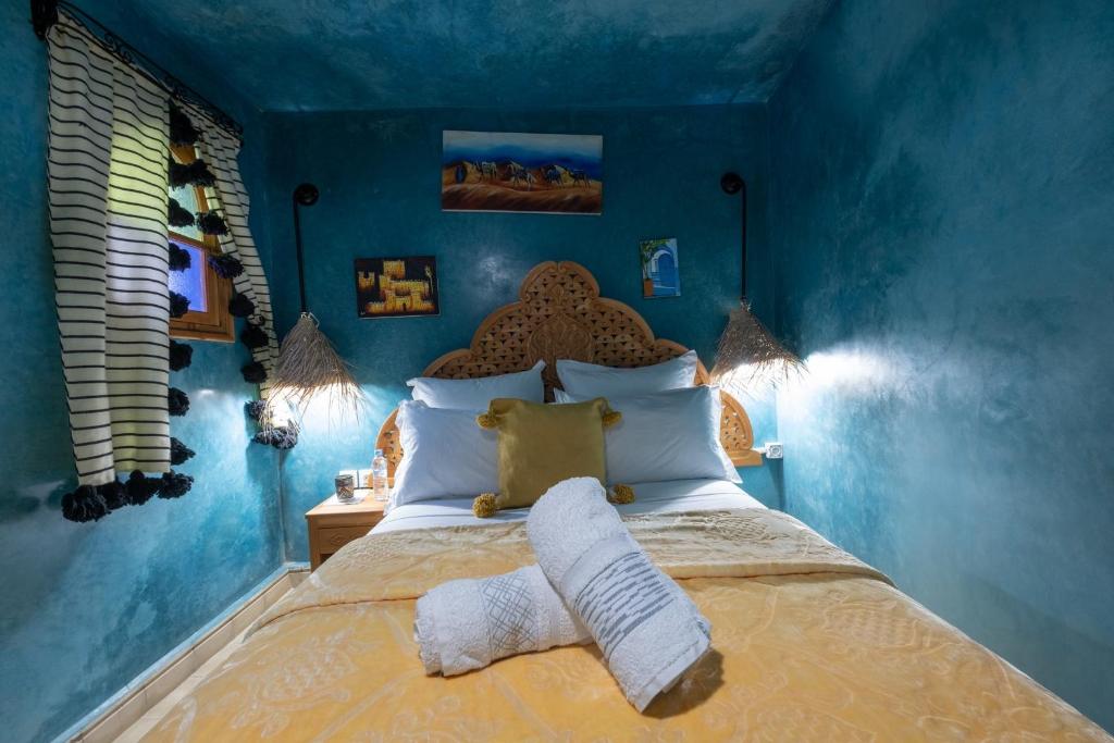 Cama ou camas em um quarto em Riad Mosaic