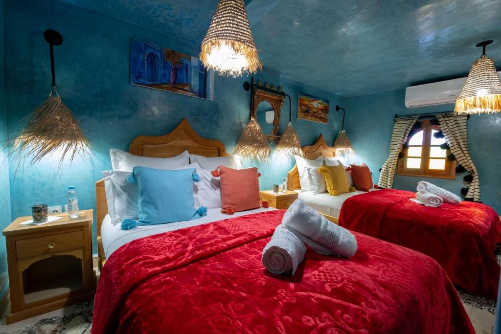 Cama ou camas em um quarto em Riad Mosaic
