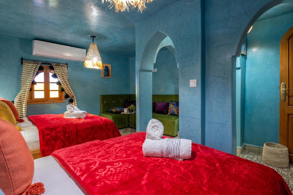 Cama ou camas em um quarto em Riad Mosaic