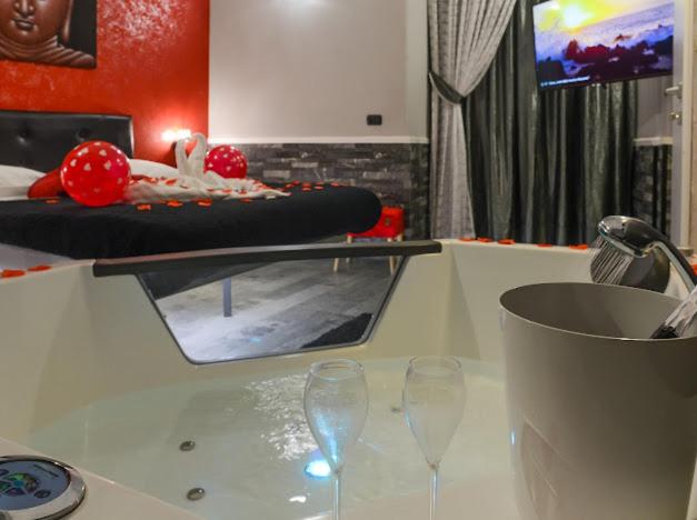 Televízia a/alebo spoločenská miestnosť v ubytovaní Sicily Suite