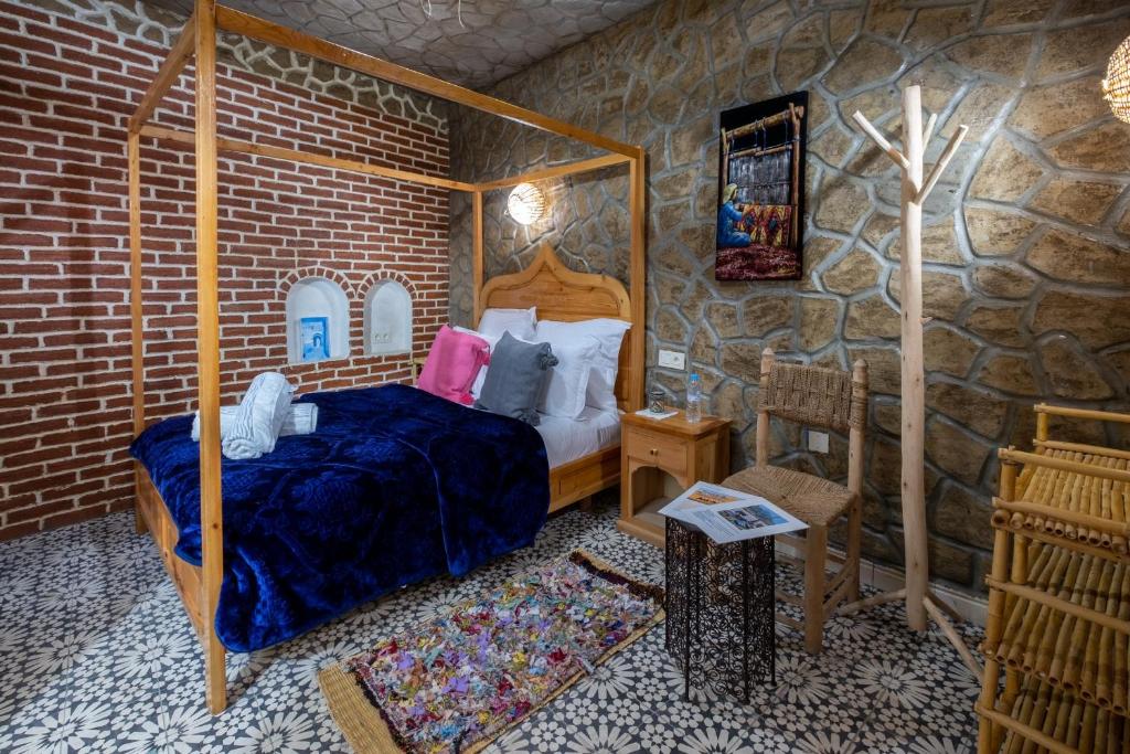 Cama ou camas em um quarto em Riad Mosaic