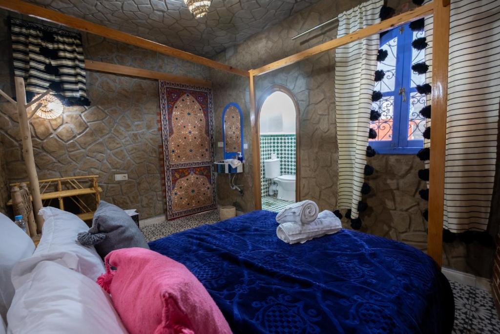 Cama ou camas em um quarto em Riad Mosaic