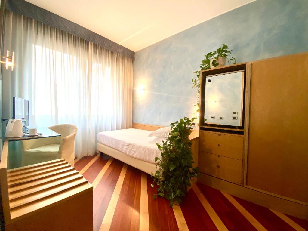 Postel nebo postele na pokoji v ubytování Hotel Sanpi Milano