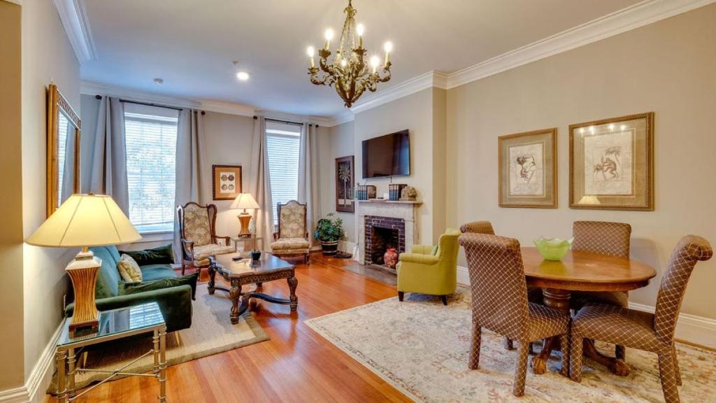 a living room with a table and a dining room at 201 York #3 · Homey Downtown 2 Bedroom Steps from the River in Savannah