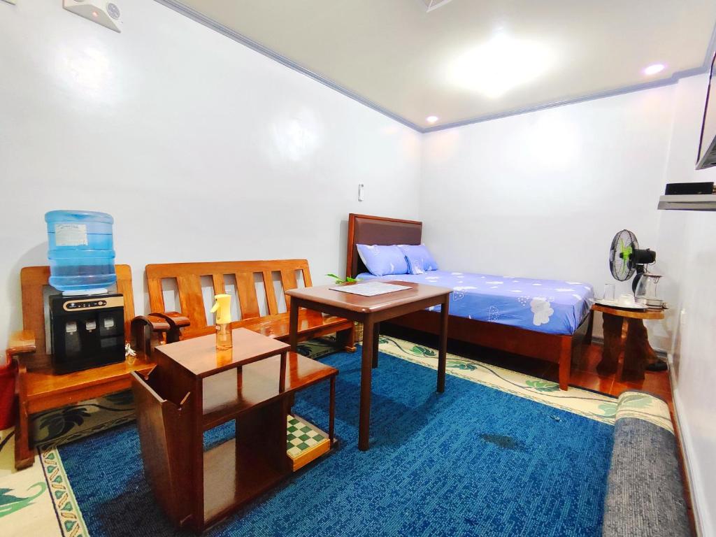 Postel nebo postele na pokoji v ubytování Evan's Homestay