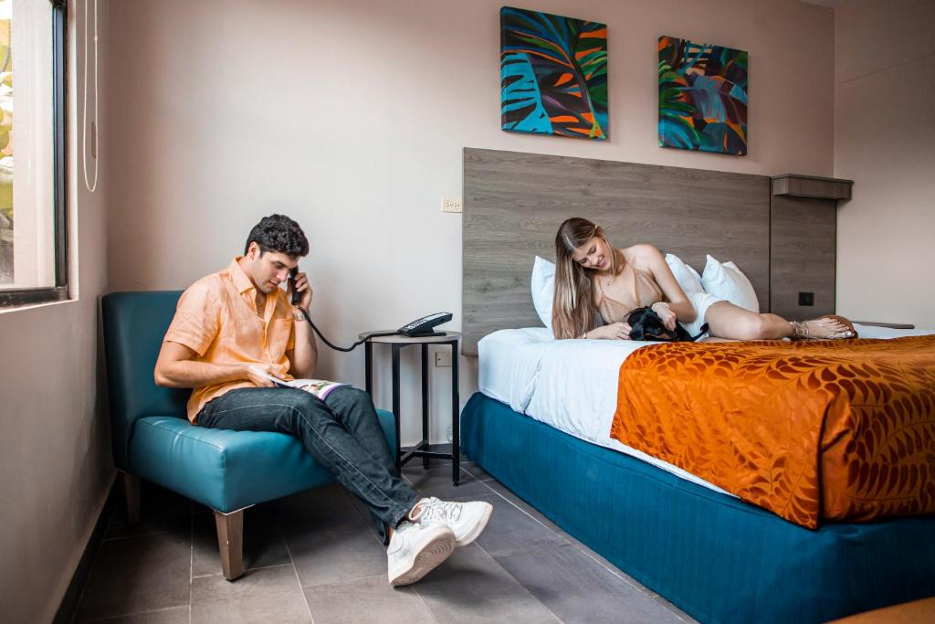 Postel nebo postele na pokoji v ubytování Parador El Faro