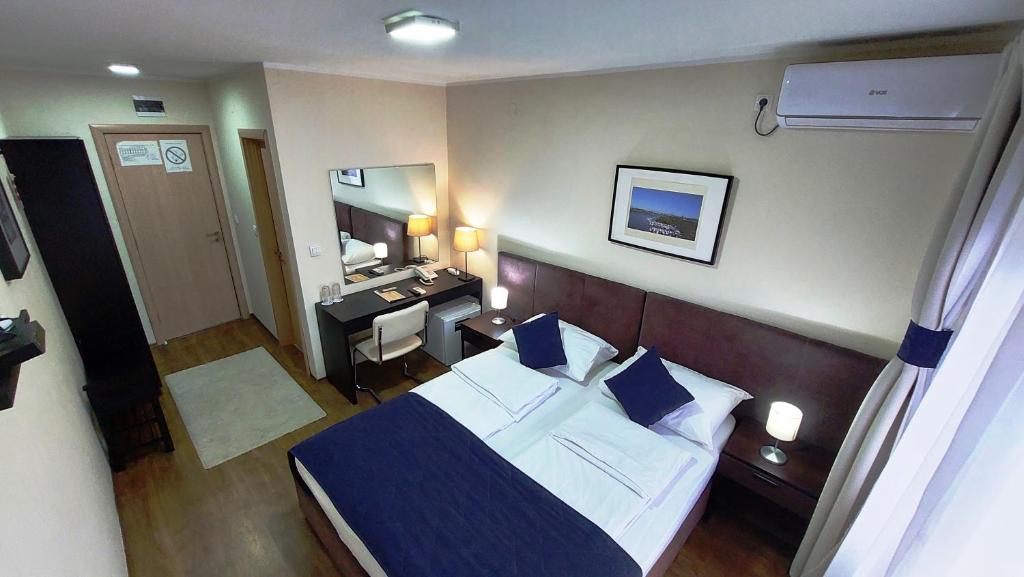 Postel nebo postele na pokoji v ubytování Hotel Villa Panorama