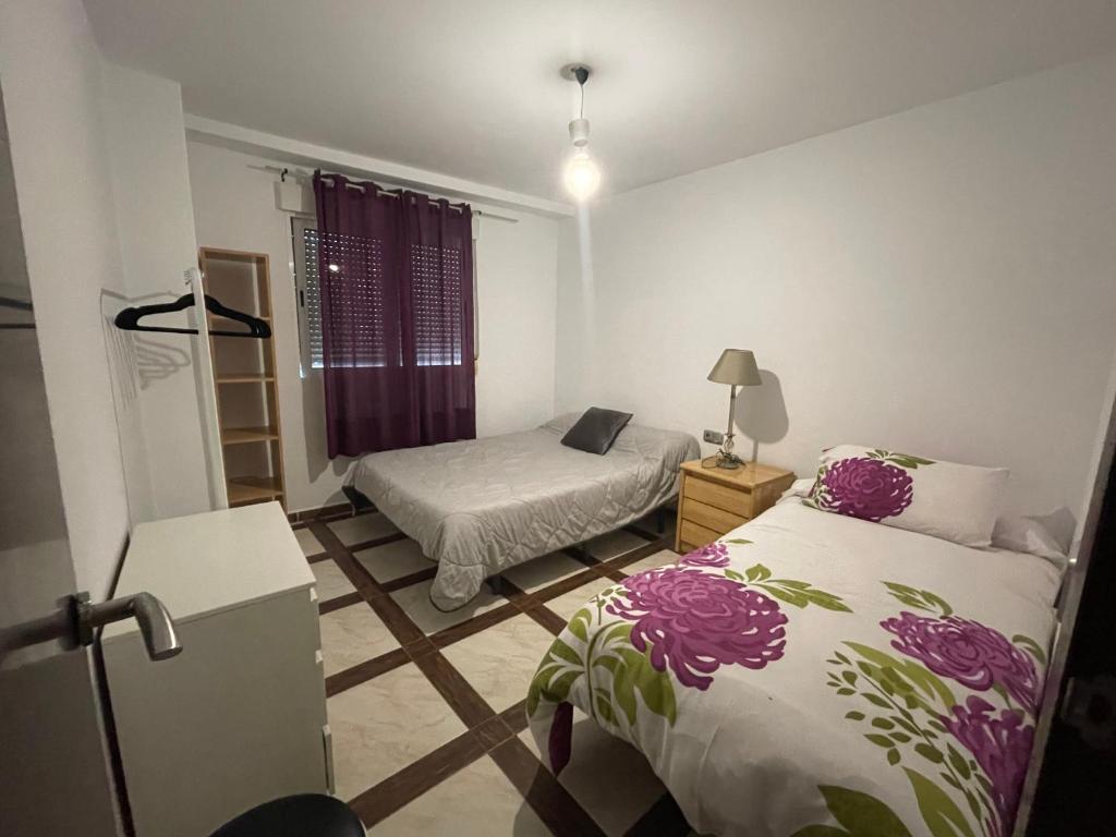 Postel nebo postele na pokoji v ubytování Apartamento de 2 dormitorios cerca Paseo Marítimo