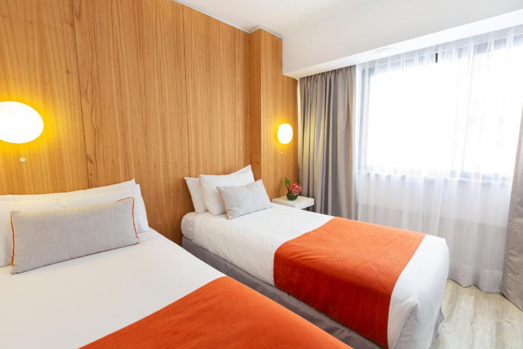 Una cama o camas en una habitación de Deco Collection