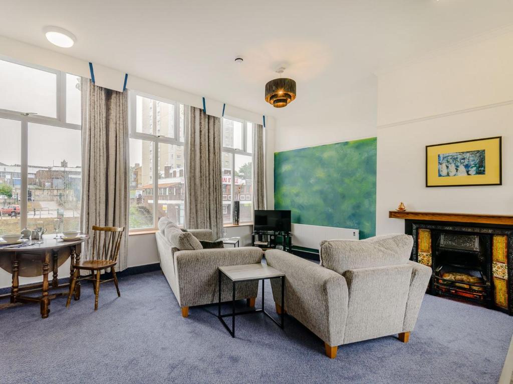 a living room with chairs and a fireplace at Crossley Suite - Uk38334 in Halifax