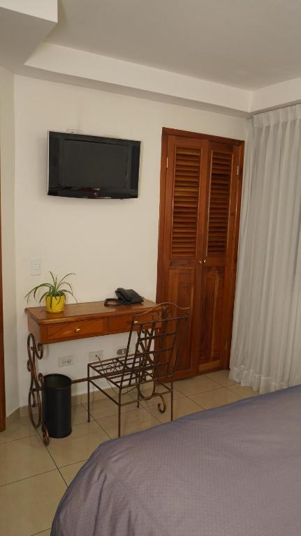 TV a/nebo společenská místnost v ubytování Hotel Casa del Arbol