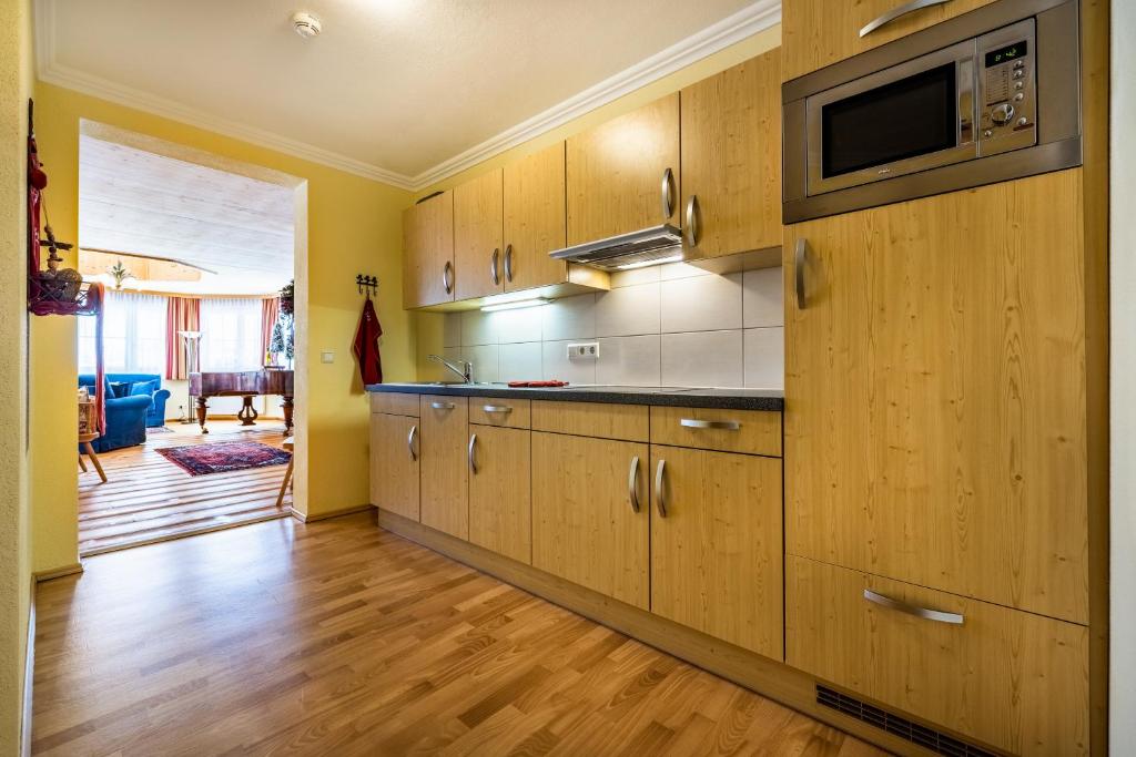Kuchyň nebo kuchyňský kout v ubytování Hotel Breitlehenalm