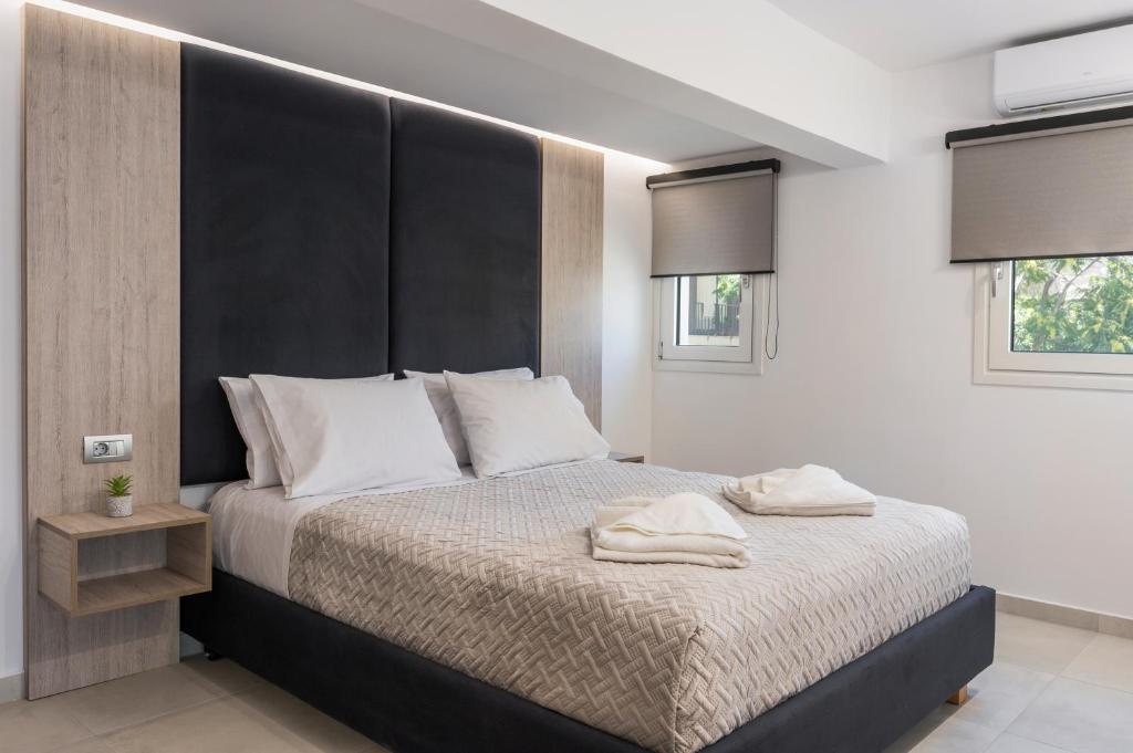 Postel nebo postele na pokoji v ubytování Quarters Luxury Apts
