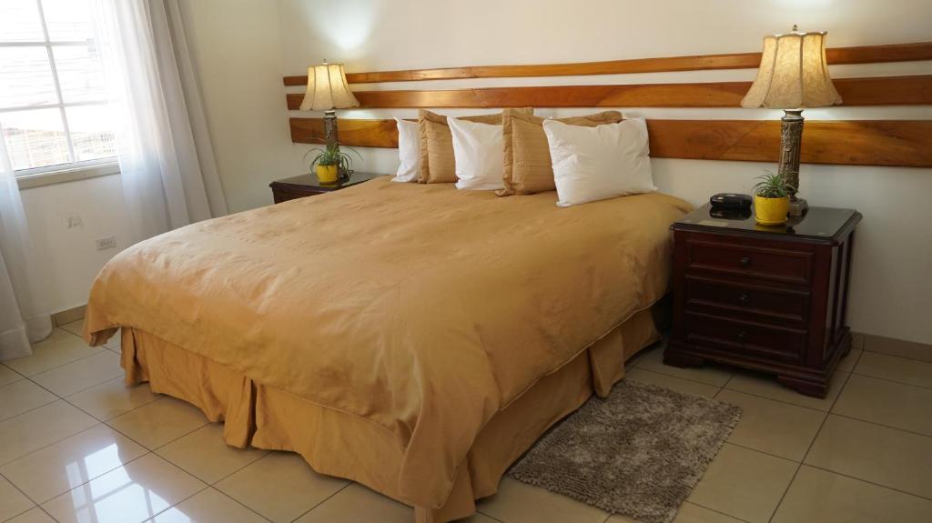 Postel nebo postele na pokoji v ubytování Hotel Casa del Arbol