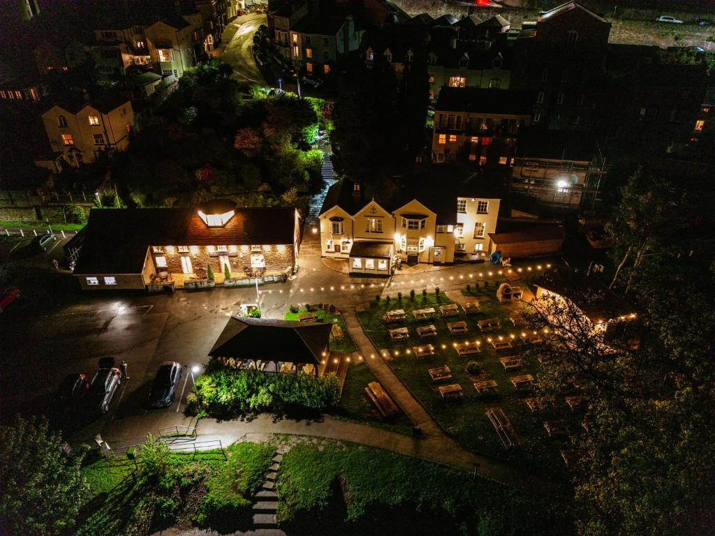 an aerial view of a town at night with lights at The Hope & Anchor Restaurant & Rooms in Ross on Wye