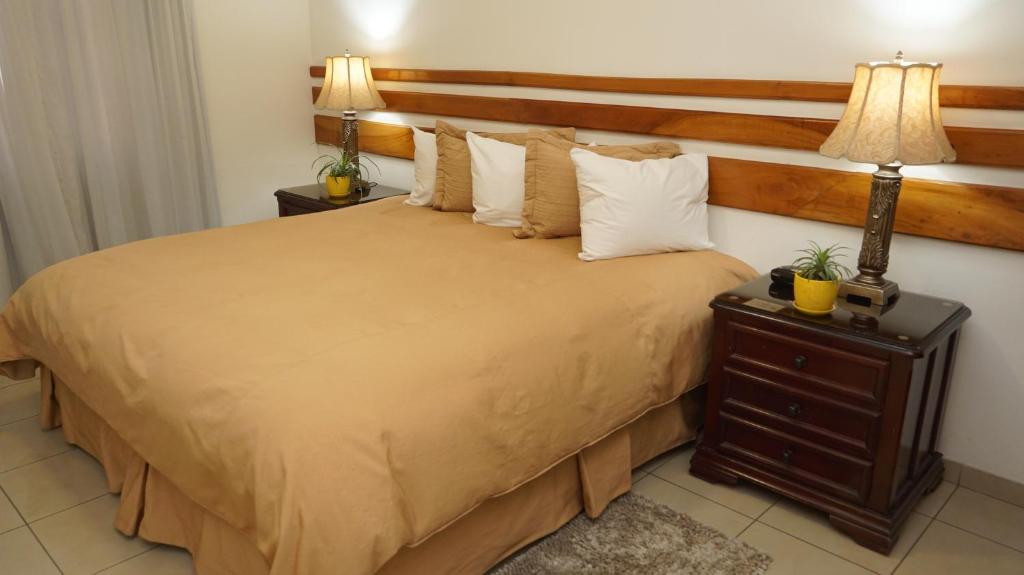 Postel nebo postele na pokoji v ubytování Hotel Casa del Arbol