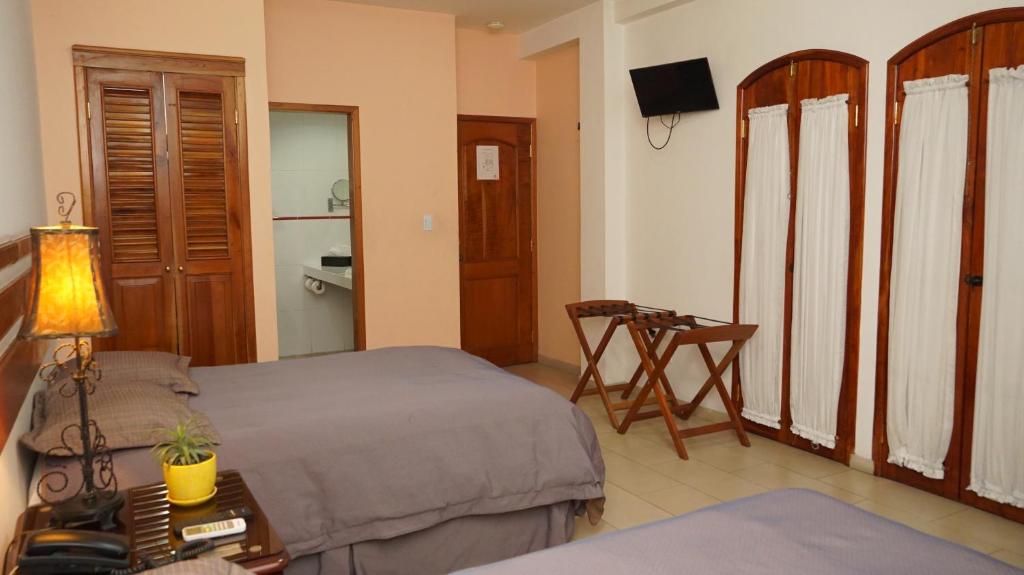 TV a/nebo společenská místnost v ubytování Hotel Casa del Arbol
