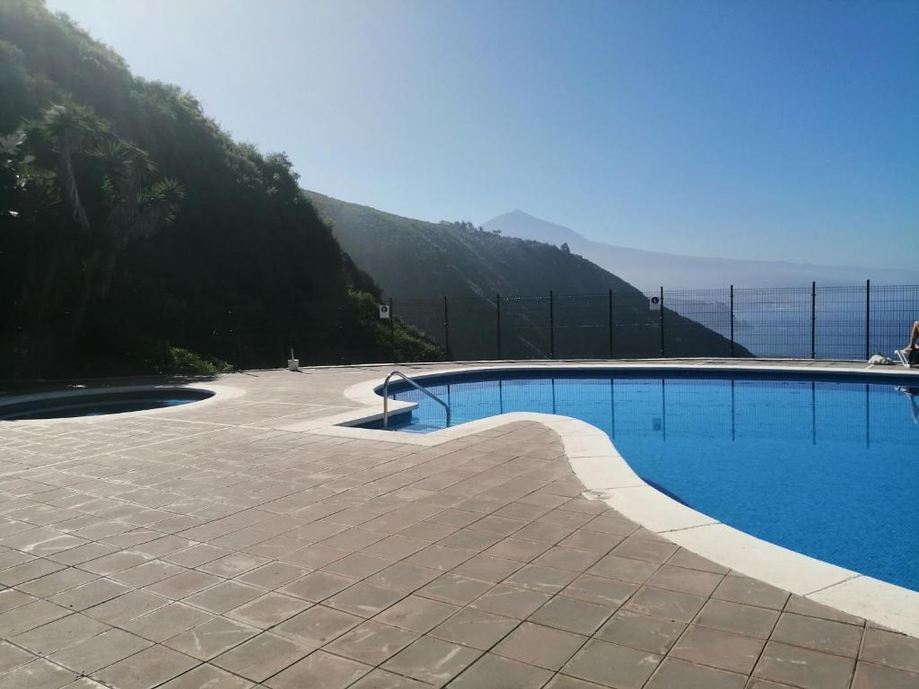 a swimming pool with a view of the ocean at Estudio Puntillo del Sol in Puntillo del Sol