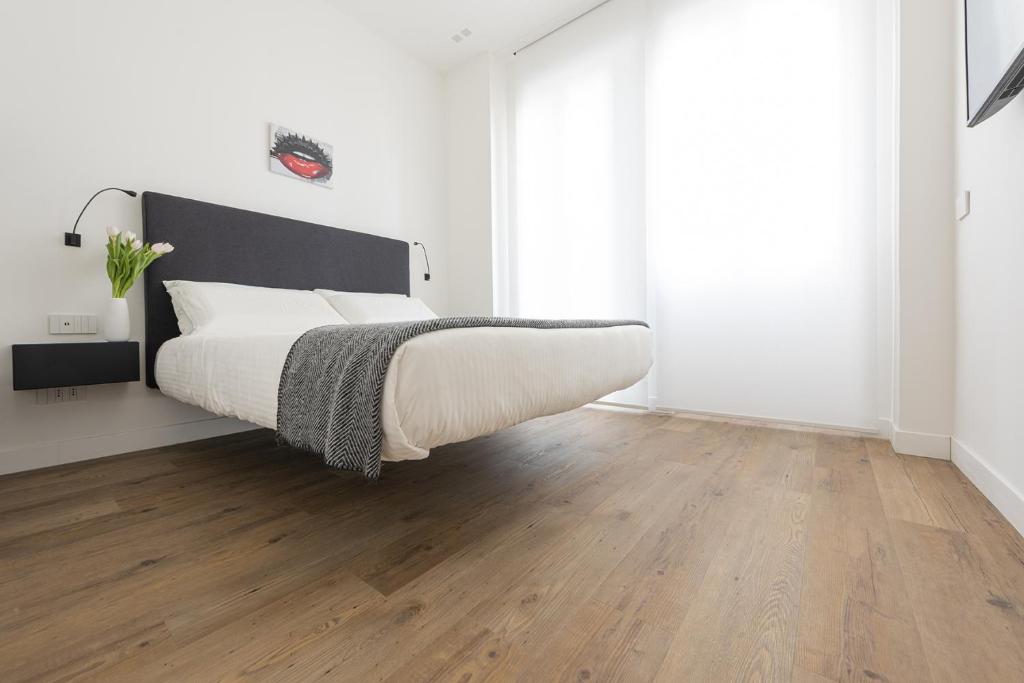 Posteľ alebo postele v izbe v ubytovaní Fiorentini Residence MILANO