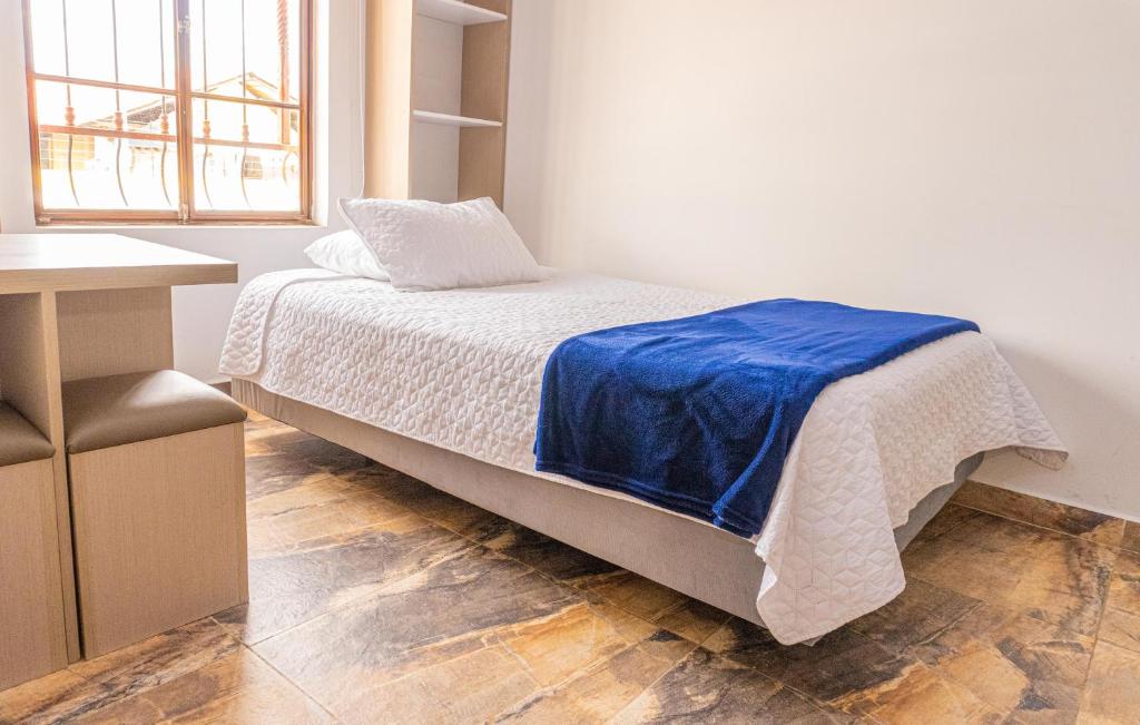 Postel nebo postele na pokoji v ubytování Hotel Salinero - Zipaquirá