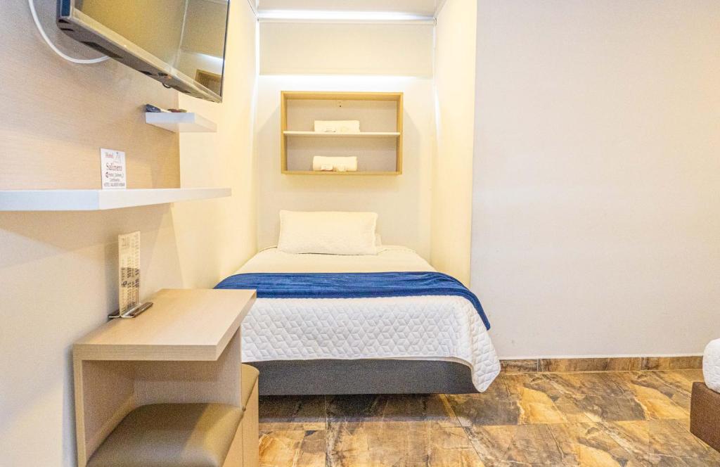 Postel nebo postele na pokoji v ubytování Hotel Salinero - Zipaquirá