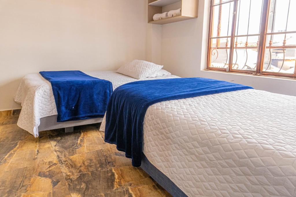 Postel nebo postele na pokoji v ubytování Hotel Salinero - Zipaquirá