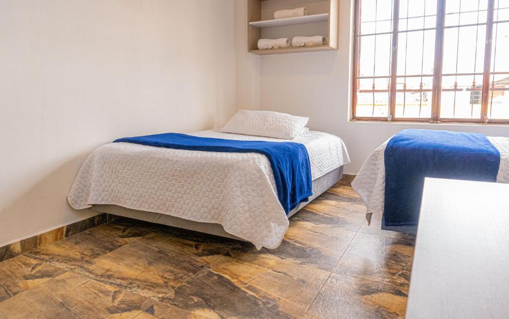 Postel nebo postele na pokoji v ubytování Hotel Salinero - Zipaquirá