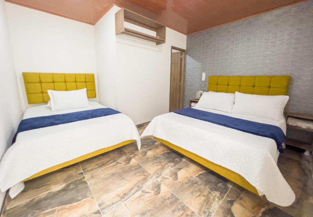 Postel nebo postele na pokoji v ubytování Hotel Salinero - Zipaquirá
