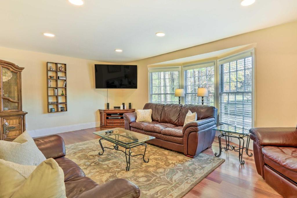 a living room with a couch and a table at Atlanta Abode with Yard in a Tranquil Setting! in Norcross