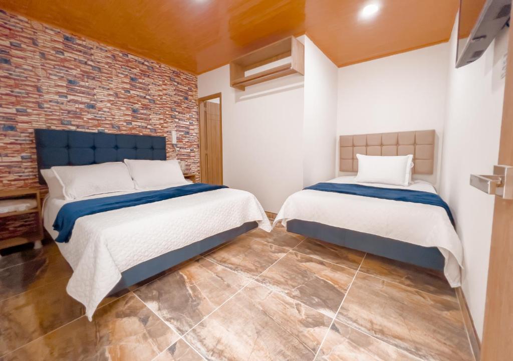 Postel nebo postele na pokoji v ubytování Hotel Salinero - Zipaquirá