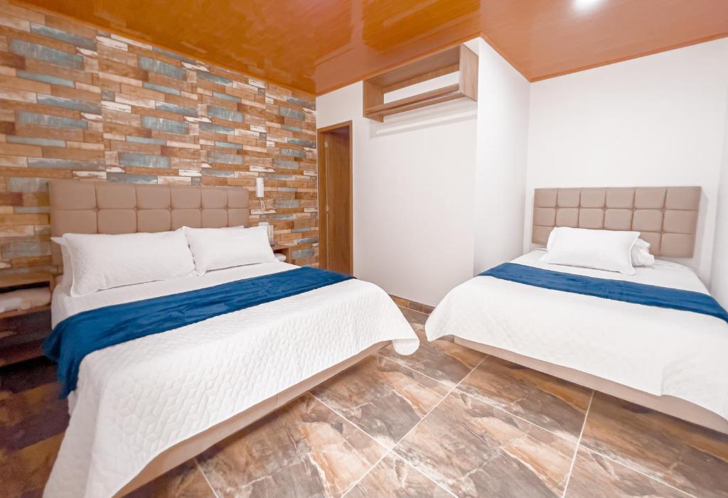 Postel nebo postele na pokoji v ubytování Hotel Salinero - Zipaquirá