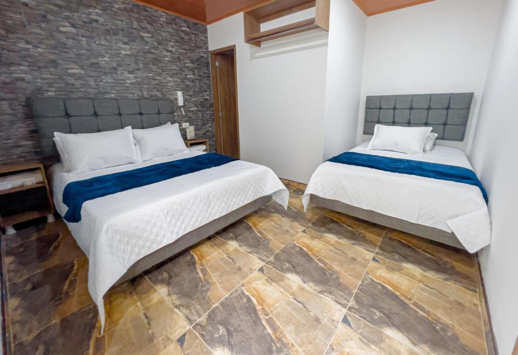 Postel nebo postele na pokoji v ubytování Hotel Salinero - Zipaquirá