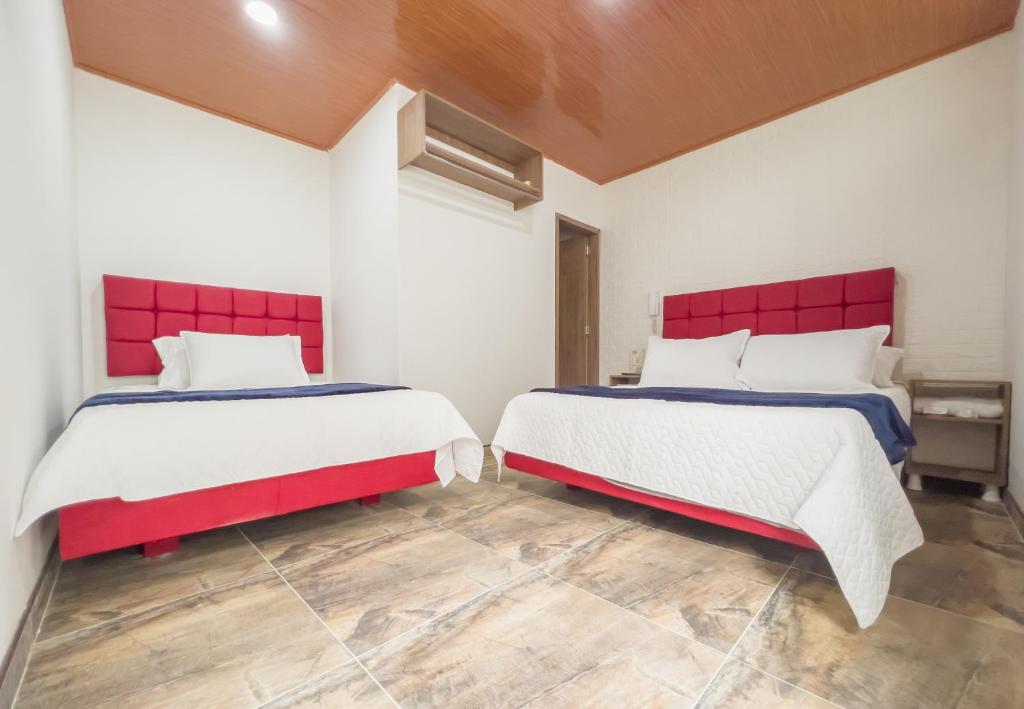 Postel nebo postele na pokoji v ubytování Hotel Salinero - Zipaquirá