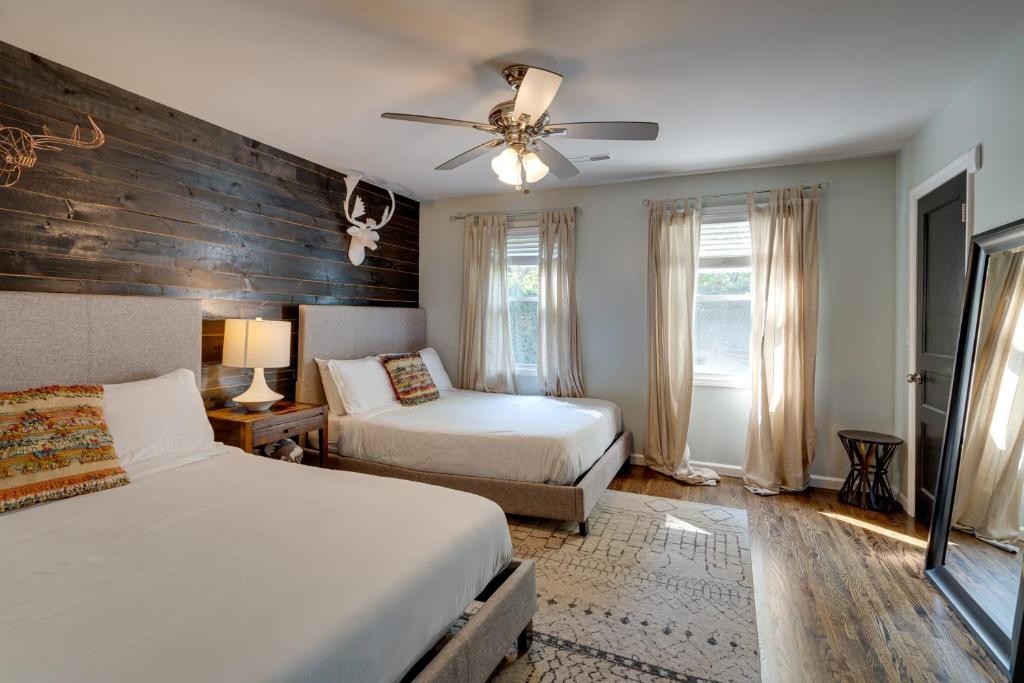 a bedroom with two beds and a ceiling fan at The Pennington - Roomy Dog-friendly Home with Yard in Nashville