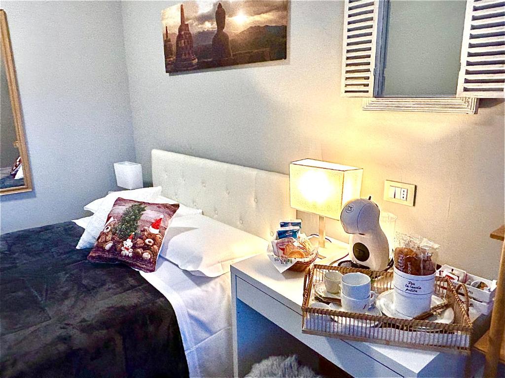 Łóżko lub łóżka w pokoju w obiekcie La Casa Di Campagna Sul Garda