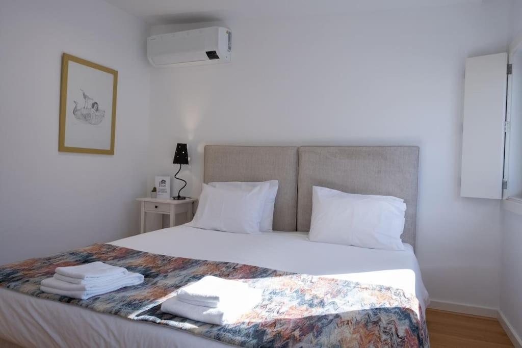 Postel nebo postele na pokoji v ubytování Porto Santa Maria Apartments